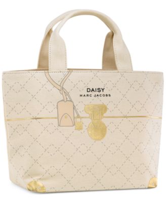 Receive a Complimentary Tote with any large spray purchase from the Daisy MARC JACOBS fragrance collection