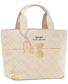 Receive a Complimentary Tote with any large spray purchase from the Daisy MARC JACOBS fragrance collection
