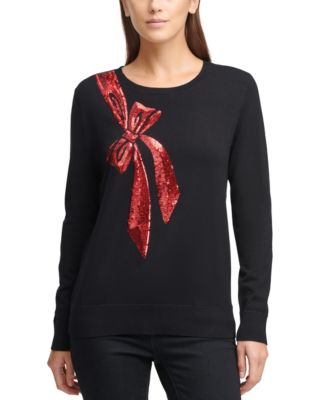 Cream christmas jumper with red outlet bow