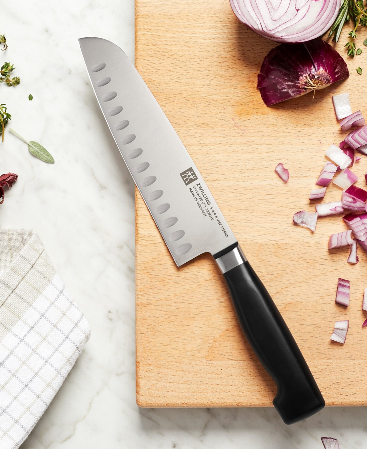 Zwilling Four Star 7-inch Hollow Edge Santoku Knife In Black