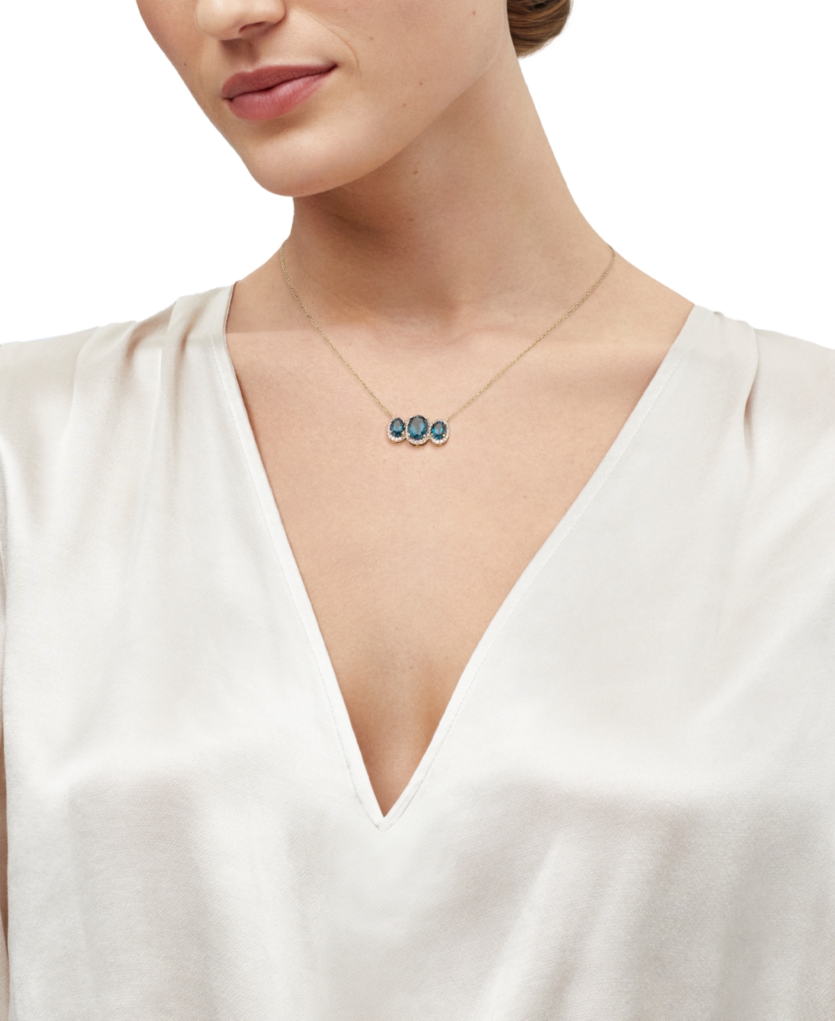 MACY'S LONDON BLUE TOPAZ (4 CT. T.W.) & DIAMOND (1/4 CT. T.W.) OVAL TRIO HALO PENDANT NECKLACE IN 10K GOLD, 