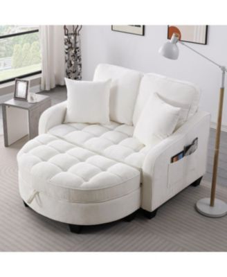 Beige two-seater sofa with chaise, storage footrest, and throw pillows