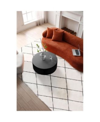 Sleek and Modern Round Coffee Table with Eye-Catching Relief Design Black
