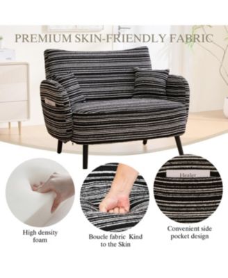 Modern two-seater sofa with armrests, pillows, and storage pockets