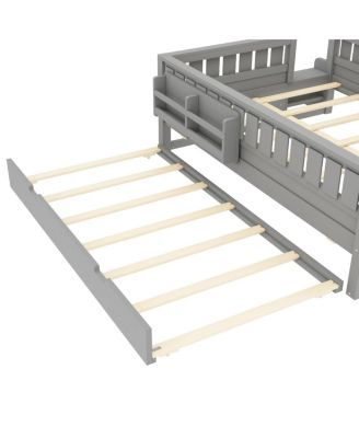 Full bed with bookshelves, staircase, safety rails, trundle