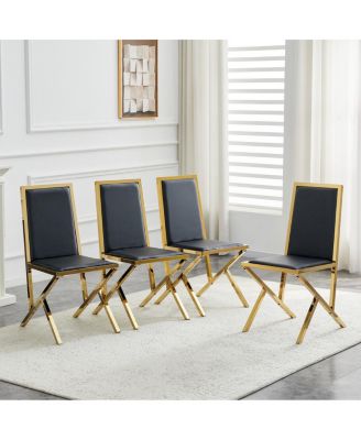 4-pack gold metal framed black PU dining chairs with ergonomic design.