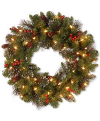 National Tree Company - 24" Crestwood Spruce Wreath with Silver Bristle, Cones, Red Berries and Glitter with 50 Clear Lights