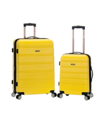 yellow hard shell luggage