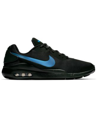 black nike shoes with blue swoosh 
