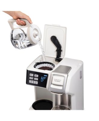 On one side of the coffee maker, you'll find a single-serve option with a removable cup rest for travel mugs and compatibility with coffee pods. On the other side, the carafe option features a programmable timer, so you can wake up to a freshly brewed pot of coffee at your preferred time. The simple control panel with an LCD display makes operation easy, while the automatic shut-off feature ensures both energy conservation and safety.