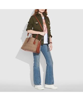 coach charlie medium carryall in pebble leather