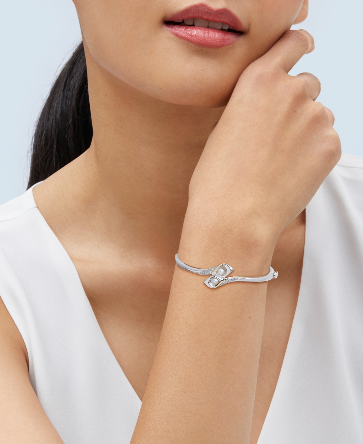 Shop Macy's Cultured Freshwater Pearl (6 X 4mm) & Diamond (1/10 Ct. T.w.) Flower Bud Inspired Bangle Bracelet In In Silver