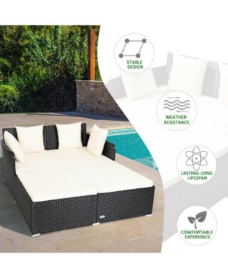 Spacious Outdoor Rattan Daybed with Upholstered Cushions and Pillows