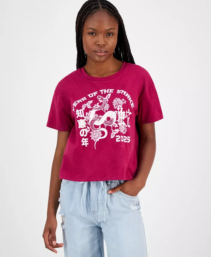 A woman in a red T-Shirt with white graphics and letters on it