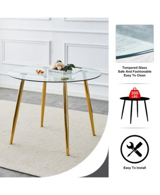 A glass tabletop with a diameter of 40 inches and a modern minimalist circular dining table with gold plated metal legs. 40 ' 40' 30 ' DT-1164