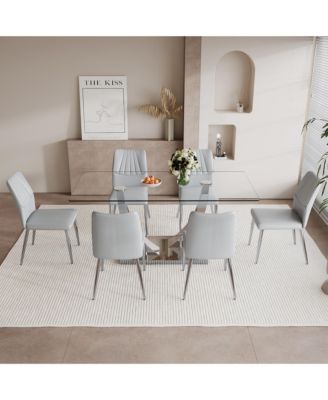Table and chair set.Contemporary, minimalist rectangular dining table featuring a clear tempered glass top and sleek silver legs. Paired with chairs made of PU material cushion and silver metal legs.