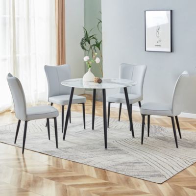 Table and chair set. Large modern white imitation marble patterned round table with black metal legs. Nice minimalism, comfortable seats and black metal legs.