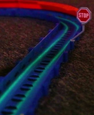 R/C  car and track with three loops and glow trace technology.