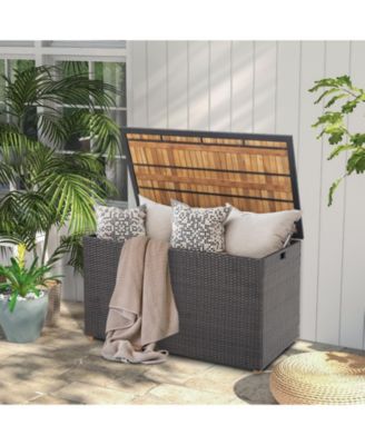 134 Gallon Rattan Storage Box With Zippered Liner And Solid Acacia Wood Top.