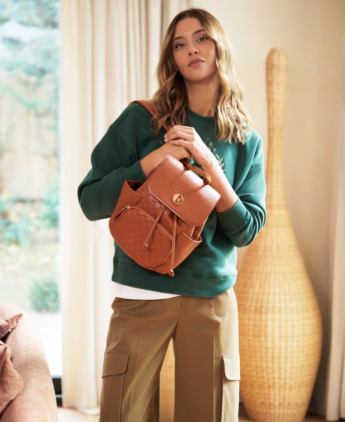 Elle Compass 10l Vegan Leather Monogram Mini Backpack In Brown