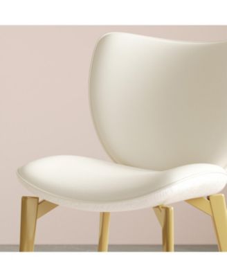  Set of 2 PU leather dining chairs with gold legs and textured backrest.