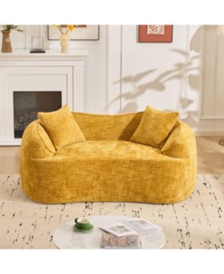 Streamdale Yellow curved two-person sofa with armrests and two pillows