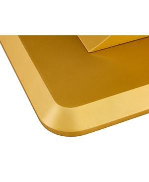 A modern minimalist dining table. Imitation marbled glass tabletop. Gold MDF table legs for kitchen and living room