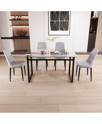 51" 4-person glass dining table set with Black metal legs & cushioned chairs.