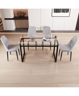 51" 4-person glass dining table set with Black metal legs & cushioned chairs.