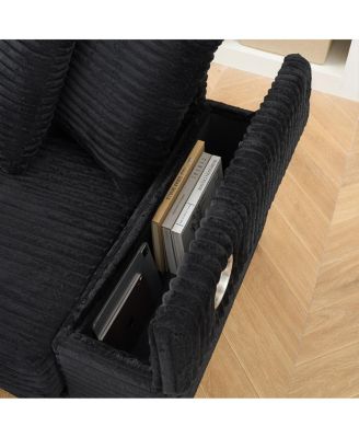 corduroy sofa with cup holder, storage, and reversible recliner.