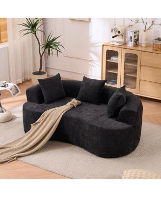 Crescent-shaped, modern self-inflating two-seater sofa with deep cushions