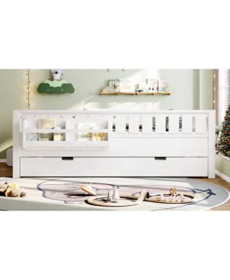 Full bed with bookshelves, staircase, safety rails, and trundle