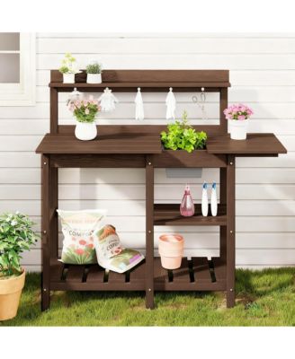 Beautiful outdoor potting rack with sink and sliding table for gardening