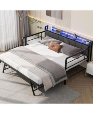 twin daybed with pop-up trundle, linen upholstery, storage headboard with charging ports, LED lights, and durable metal frame