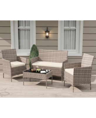 4-Piece Rattan Patio Furniture Set with Upholstered Sofa and Coffee Table