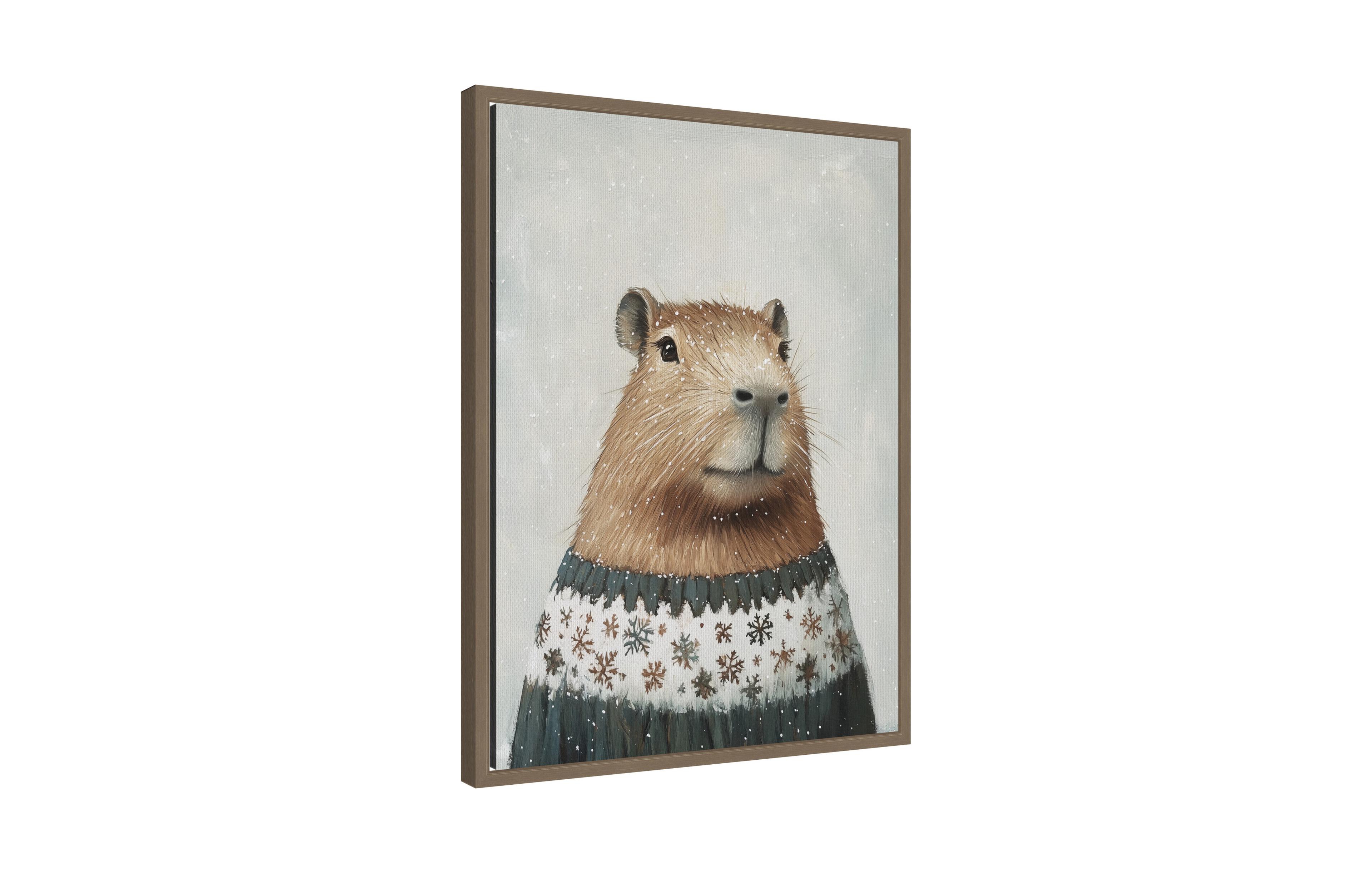 Kate and Laurel Sylvie Framed Canvas Capybara in Winter Snowflake Sweater by The Creative Bunch Studio