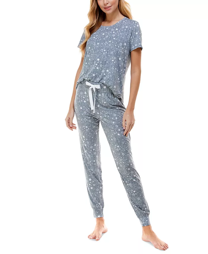 A woman wearing a grey loungewear set with stars on it
