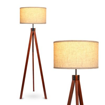 yellow wooden tripod floor lamp