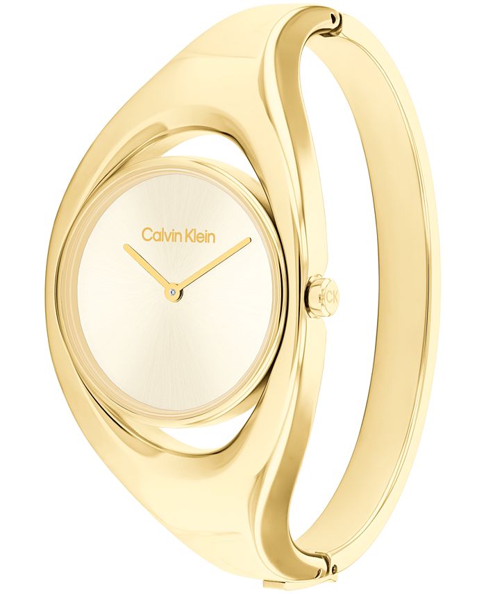 Calvin Klein Women's Two Hand Gold-Tone Stainless Steel Bangle Bracelet ...