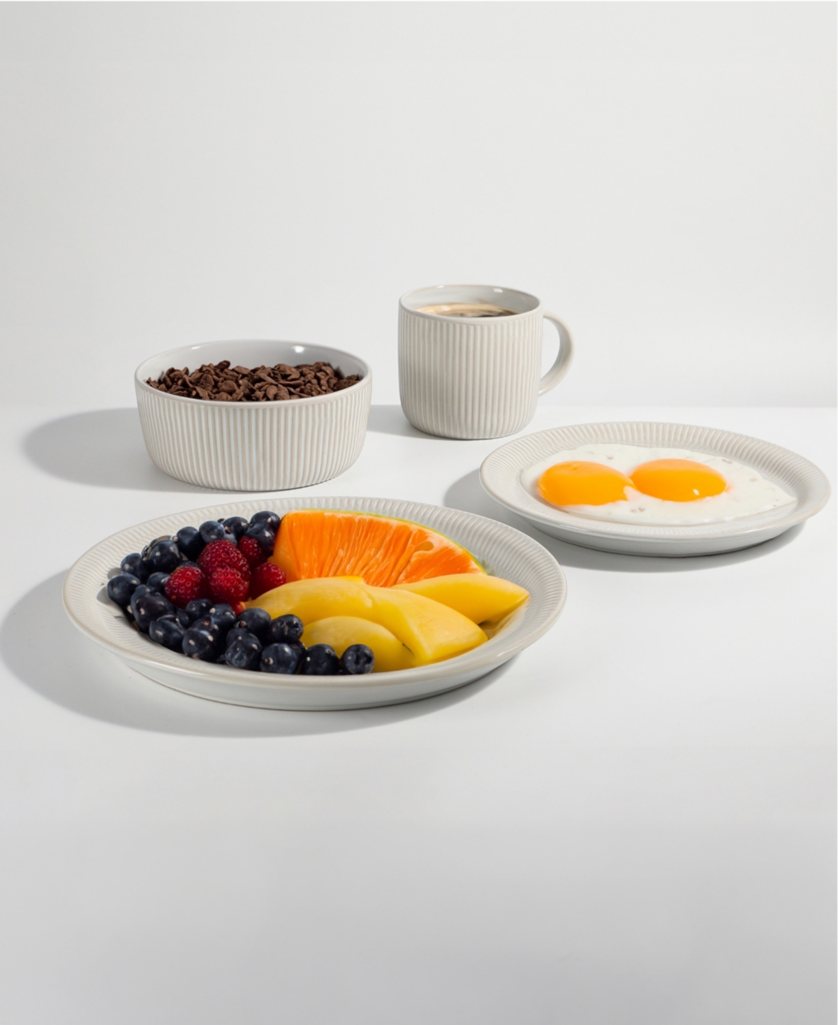 Table 12 Parchment Embossed 16 Piece Dinnerware Set, Service For 4 In White