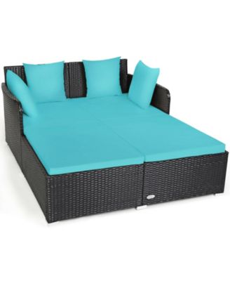Spacious Outdoor Rattan Daybed with Upholstered Cushions and Pillows