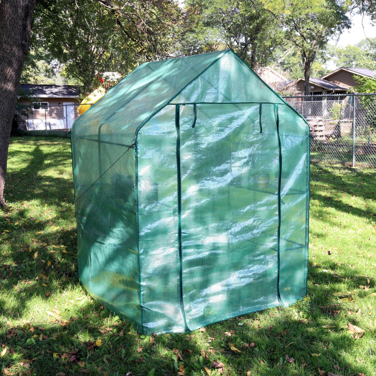 Sunnydaze Decor Iron Pe Cover Walk-In Greenhouse with 4 Shelves -- Green