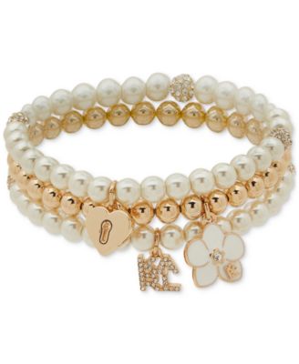 KARL LAGERFELD PARIS - Gold-Tone Imitation Pearl Three Row Charm Orchid Stretch Bracelet