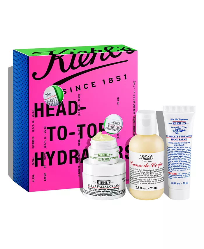 A pink, blue, and green box with four skincare products in front of it