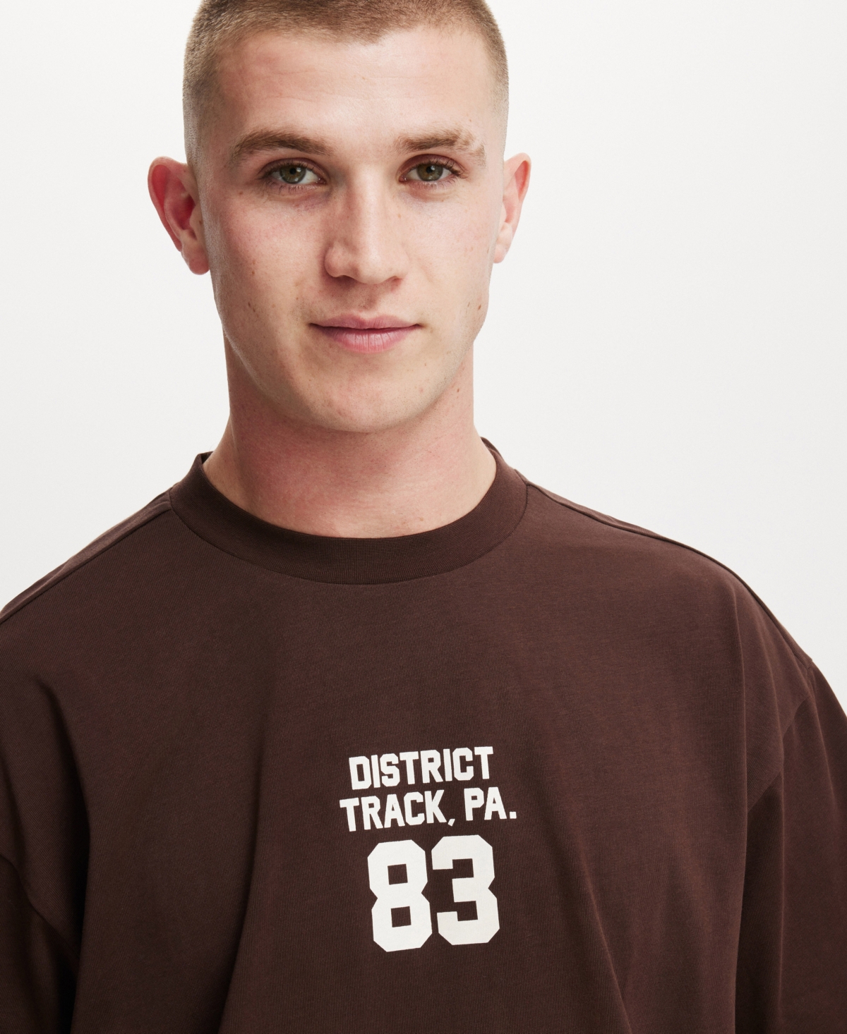 Cotton On Men's Box Fit College T-Shirt -District Track