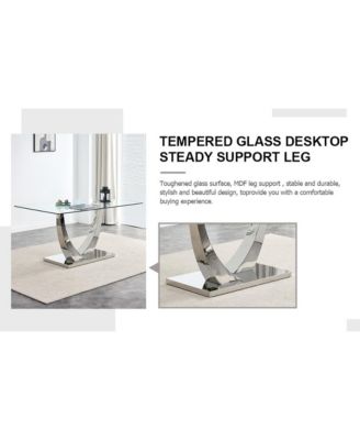 Table and chair set.Contemporary, minimalist rectangular dining table featuring a clear tempered glass top and sleek silver legs. Paired with chairs made of PU material cushion and silver metal legs.