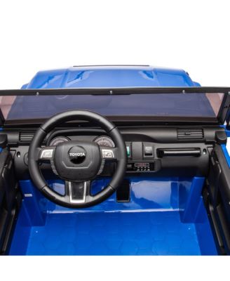 24V Two-seater Kids Ride On Car W/Parents Remote Control, Licensed Toyota LC250,110w Motors, With Shovel, Three-point Seat Belt, Slow Start, Speed adjustment, Bluetooth, Music for Kids Aged 3+.