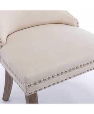 2 Beige Wingback Dining Chairs with Nailhead Trim & Wood Legs