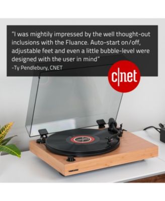 RT82 – Walnut high-fidelity turntable with Ortofon OM10 cartridge, speed control motor & vibration-isolation feet.