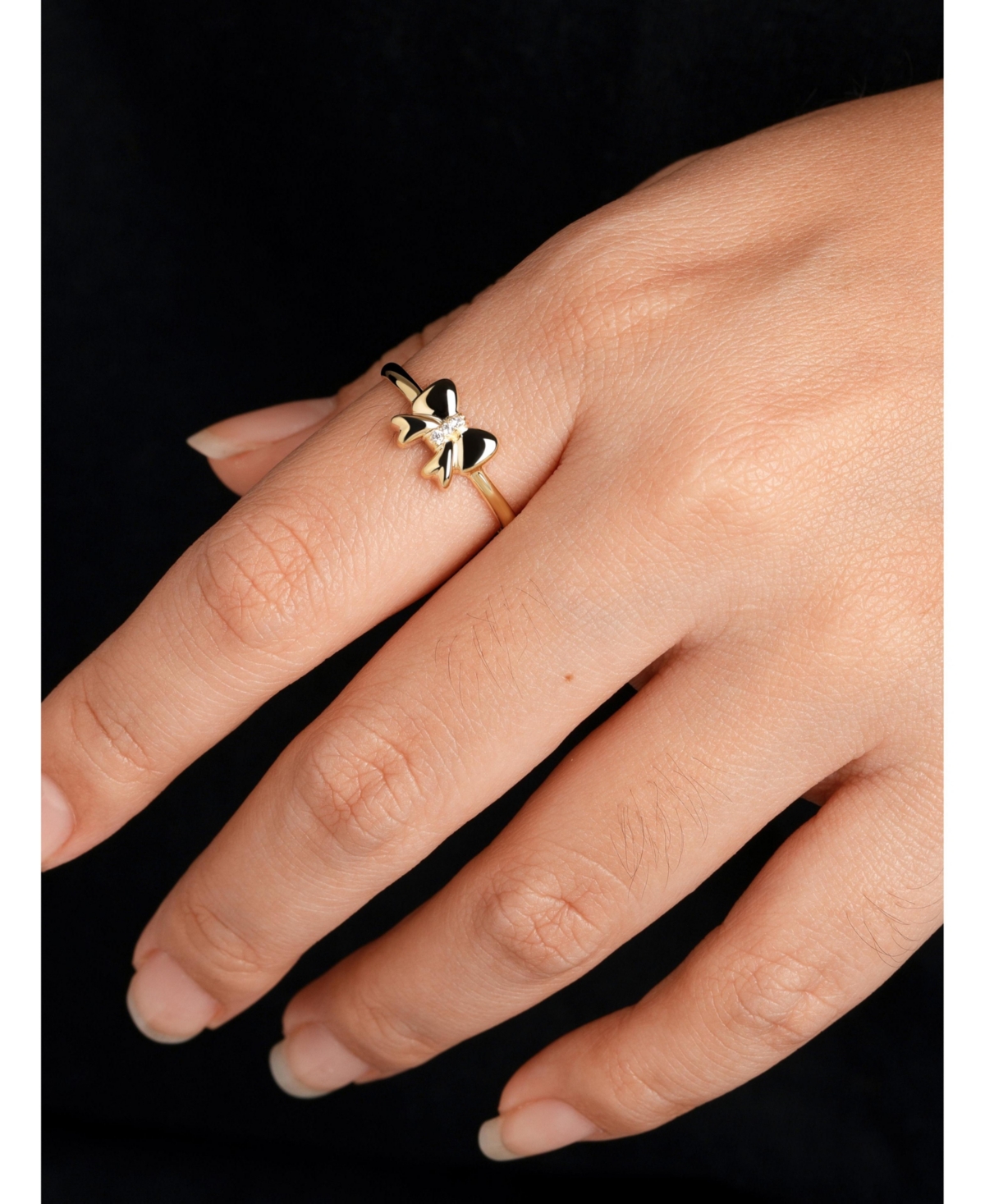 Devata Bow Ring in 14K Gold, Size 8, approx. 1.7 grams.